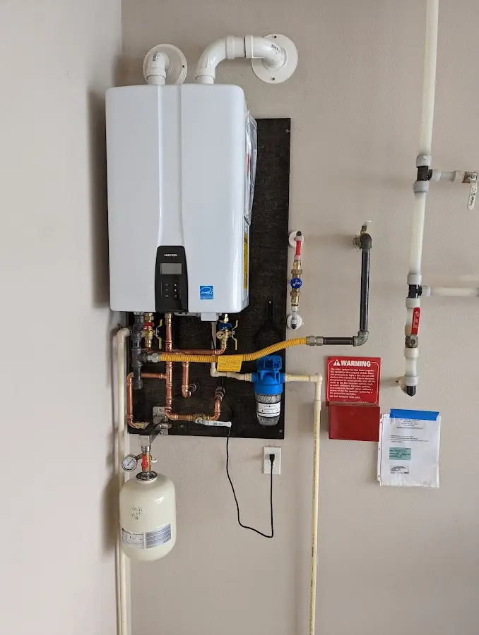 Professional plumber installing copper piping in a Carbondale home